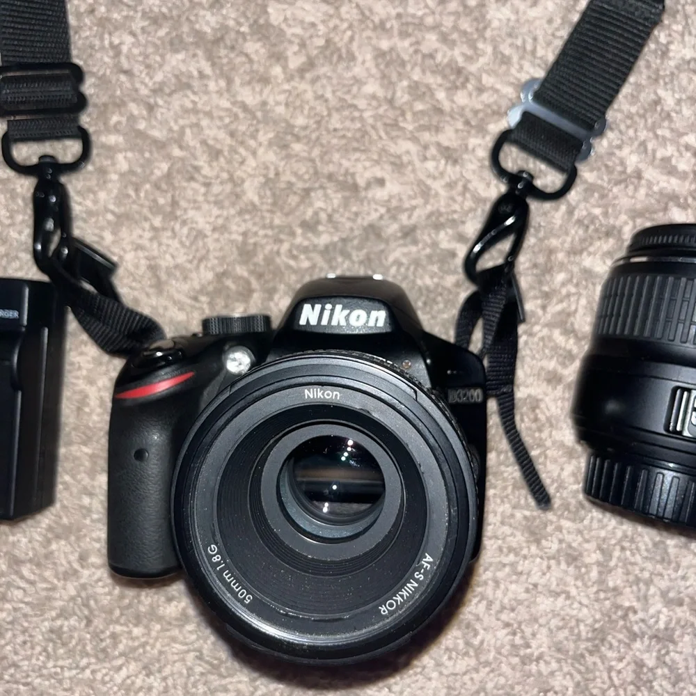 Nikon D3200 Camera. Includes Battery, 3 Nikon Lenses, Battery Charger, and Case.
